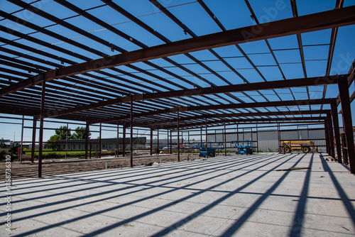 Commercial steel frame building in construction process.