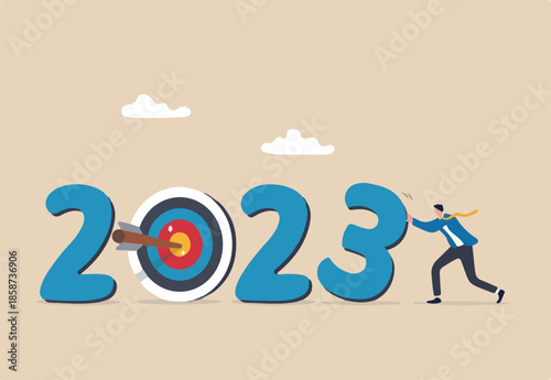 Year 2023 business target, new year resolution or challenge to achieve goal, aim for business success, growth or motivation to succeed concept, businessman changing year to 2023 target
