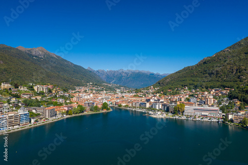 Tableau sur toile Wide panoramic view of Omegna on the northern shore of Lake Orta in Italy, surrounded by forested hills and distant mountain peaks