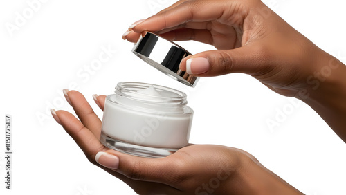 Skincare Ritual: A person delicately holds a jar of skin cream, revealing the creamy contents and lid in hand, evoking a sense of beauty and self-care.