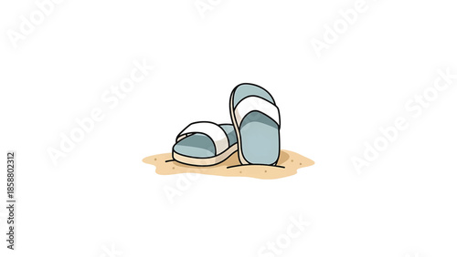 A pair of blue and white slip-on sandals sit on a patch of light brown sand