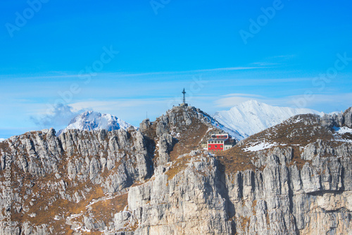 Photos Mount Resegone and the Azzoni Alpine refuge (Italian: Rifugio Azzoni), seen from the Sentiero delle Creste, a trail for expert hikers among vertical cliffs and limestone crags