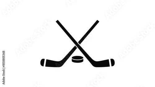 Two crossed hockey sticks and a puck on a white background