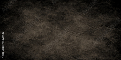 A dark grunge background featuring a vintage aged paper texture over a rough black concrete wall surface for a dirty industrial backdrop design