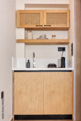 Photos Stylish hospitality corner with custom joinery including upper and lower wooden