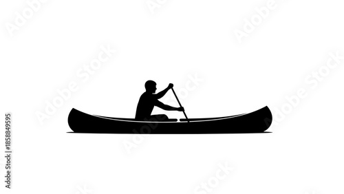Silhouette of a person canoeing on a serene body of water