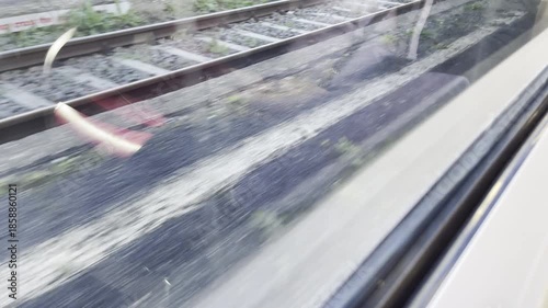 Railway tracks view from moving train with motion blur effect