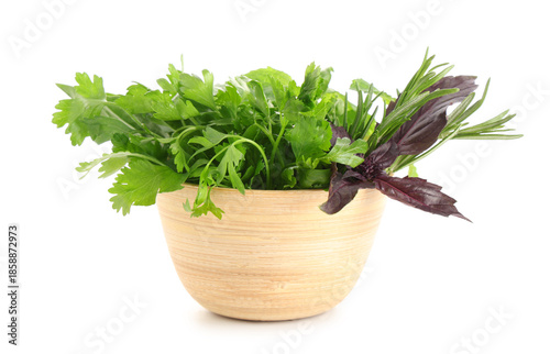 Wooden bowl with fresh herb...