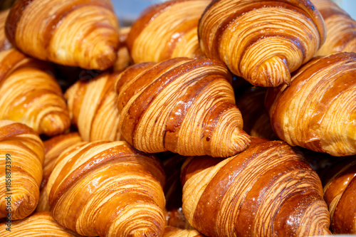Breakfast in France, fresh baked butter croissants pastries in artisanal bakery in Paris, France, close up