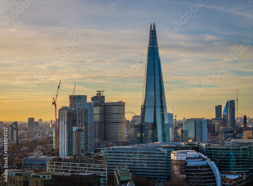Aerial drone view of The Shard in London skyline - iconic skyscraper rising above the city panorama during a sunset
