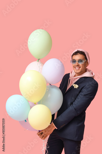 Cool young man with balloon...
