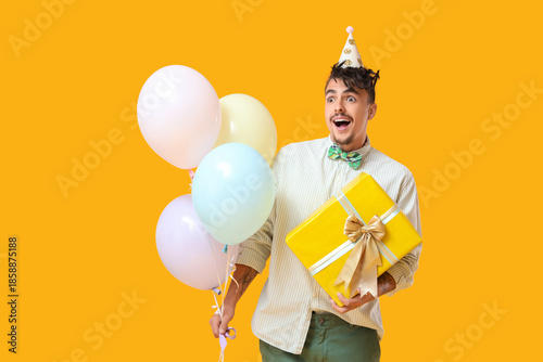 Happy young man with gift a...