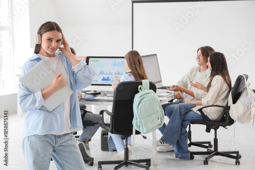 Female student in headphone...
