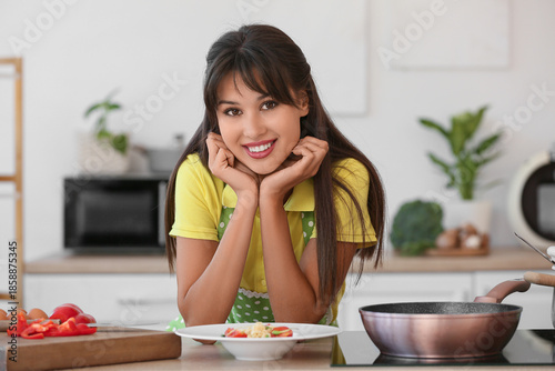 Young housewife with tasty ...