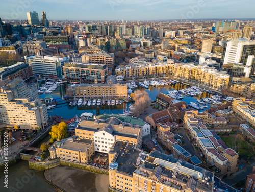 St Katharine Docks. Aerial drone view of Saintt Katharine Docks in London - historic marina, yachts and modern city architecture
