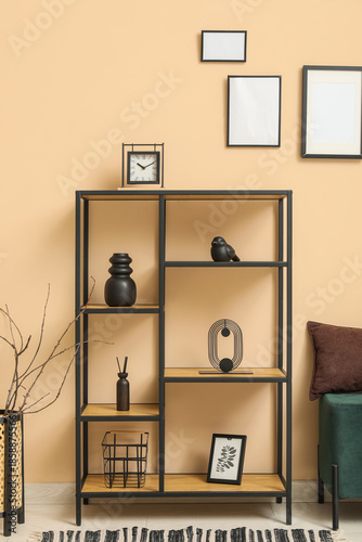 Black shelf unit with styli...