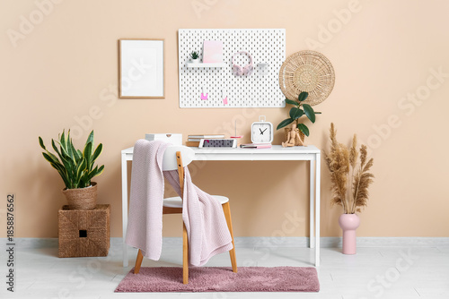Stylish workplace with tabl...