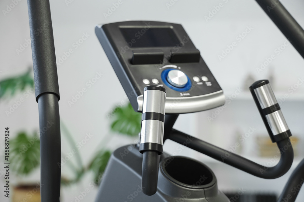 Obraz premium Panel of modern exercising bike in stylish room, closeup