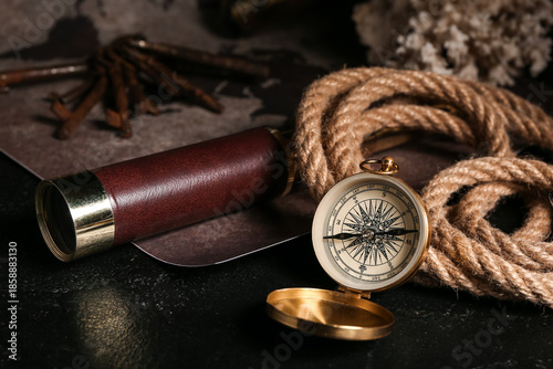 Golden compass, rope, spygl...