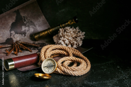 Golden compass, rope, spygl...