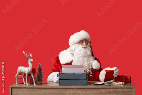 Santa Claus with envelopes,...