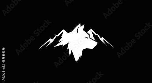 Majestic Wolf Head Silhouette Against Mountain Peaks.