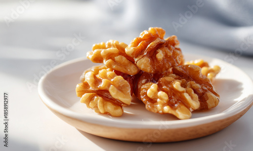 Glossy fresh walnuts on white plate under natural light. generative aI