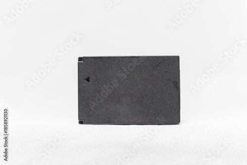 Camera battery against a white background in Rio de Janeiro.