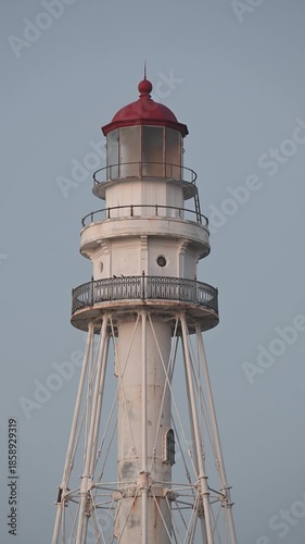 Closeup of the Rawley Point Lighthouse in the pre-dawn light.  Vertical video taken along Lake Michigan at Point Beach State Forest, Manitowoc, Wisconsin.