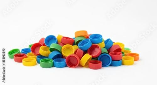 Pile of colorful plastic caps, assorted, on a clean white background
