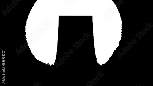 Mockup of a Vertical Black Canvas Hanging on a Neutral Wall with Overhead Spotlight Illumination