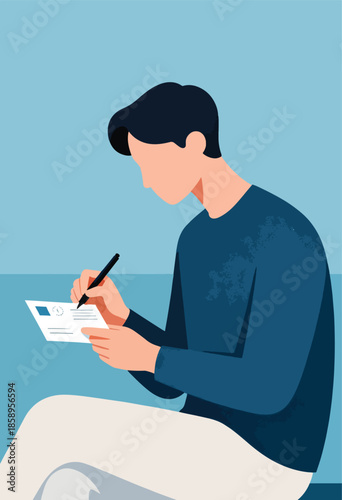 Person in blue shirt writes on a postcard with a black pen