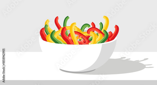 Colorful bell pepper strips in a white bowl, ready for cooking.