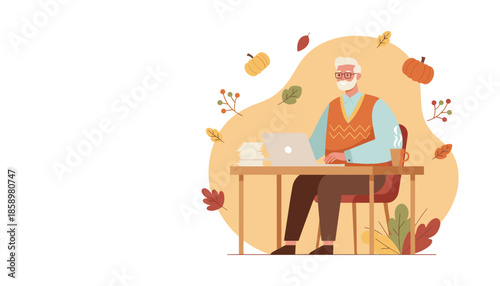 Elderly man works on a laptop at a desk surrounded by Autumn decorations illustrating productivity