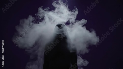 Dark silhouette with smoke cloud surrounding the figure.