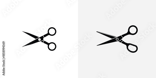 Two Black Scissors Facing Opposite Directions white background