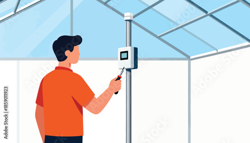 Person adjusting device on a pole inside a bright, modern structure