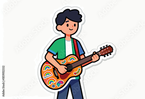 A boy with dark hair plays an acoustic guitar decorated with colorful stickers