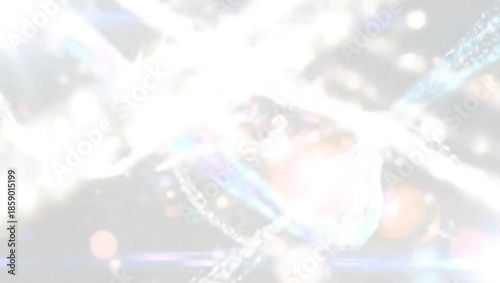 Abstract light particles moving and flowing in a dynamic pattern with lens flares.