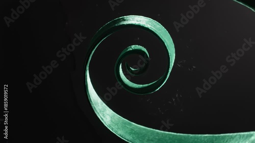 Close Up Spiral of Green Plant Stem Growing Against Black Background