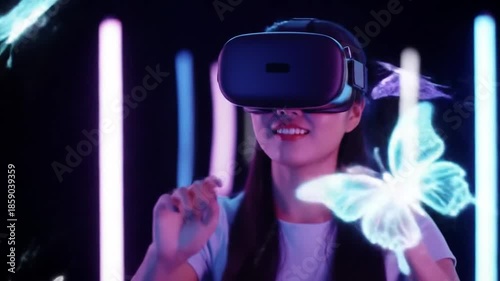 A woman wearing a virtual reality headset reaches out to touch a glowing butterfly