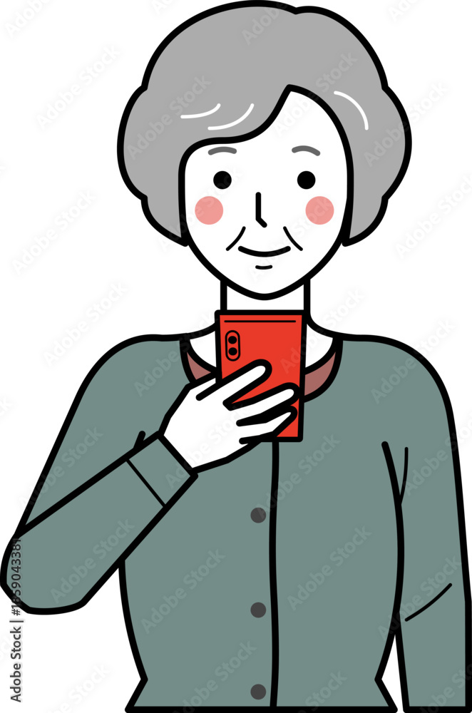 Fototapeta premium 正面向き。スマホを見るカーディガンを着た高齢女性。