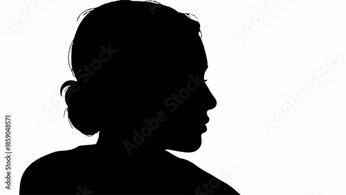 Profile silhouette of a woman with her hair in a bun against a bright background