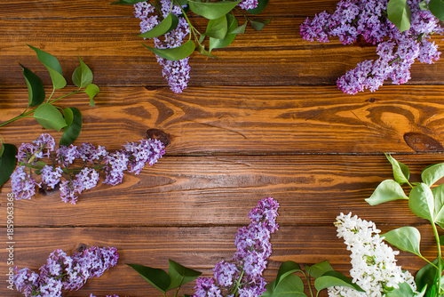 Spring bouquet of lilac on textured wood with copyspace