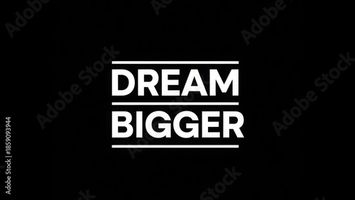 Inspirational text on a black background encouraging viewers to 'Dream Bigger'.