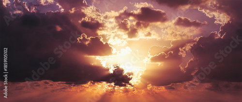 Foto Radiant Sunset Bursting Through Dark Dramatic Clouds, Casting Golden And Pink Be