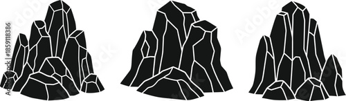 Three jagged rock formations a striking silhouette on transparent background