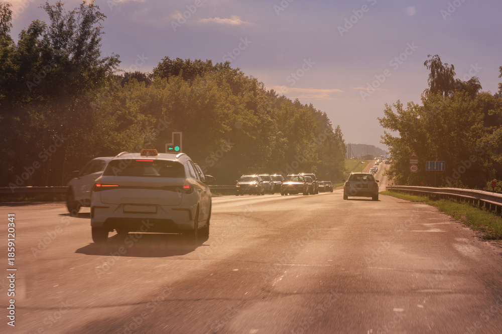 Fototapeta premium orange evening views of the road highway on a sunny day in summer. 