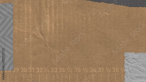 Textured abstract composition with torn paper pieces a grayscale chevron element and a graduated ruler