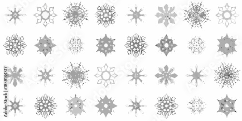 An assortment of delicate snowflake designs displayed against a plain white background